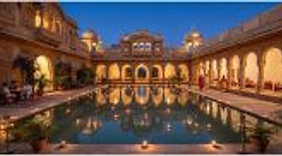 Heritage palace courtyard reflection pool illuminated at dusk
